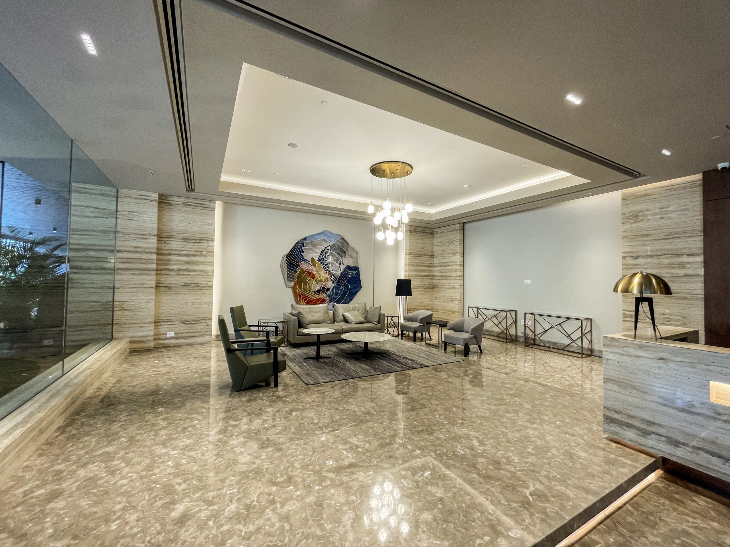 a marble floor with 4 chairs in the middle of it.