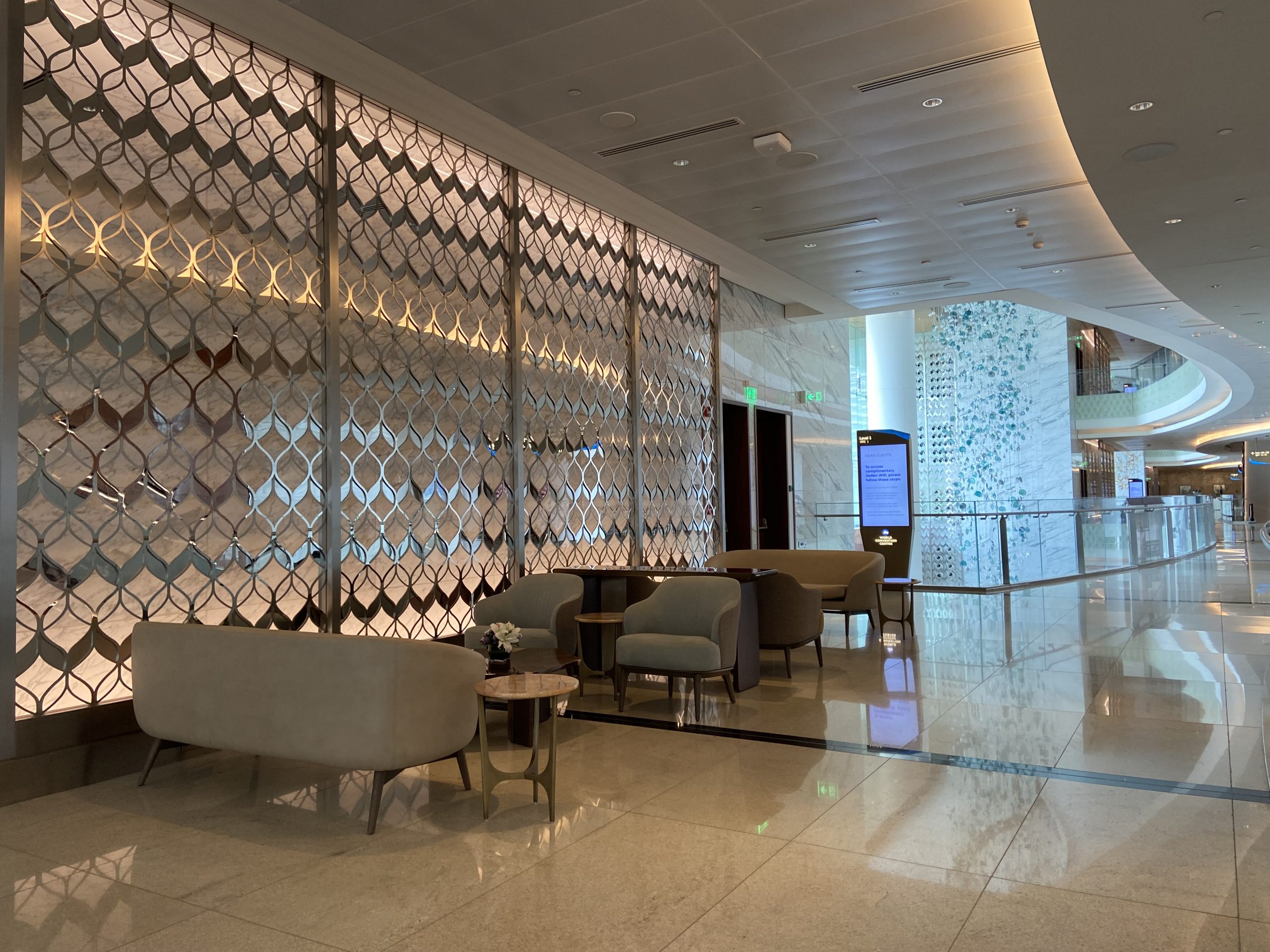 a hallway with a 4 chair on the marble floor